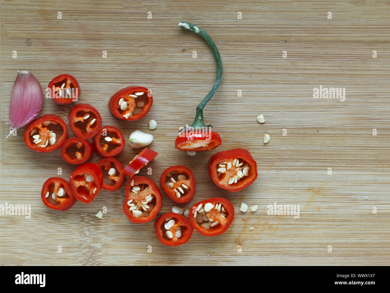 Hot chili pepper chopped on a cutting board Stock Photo - Alamy