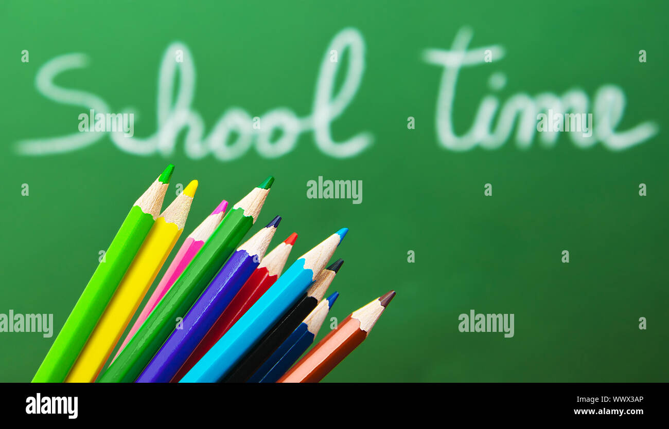 Back to school concept, green chalkboard with handwriting and set of ...