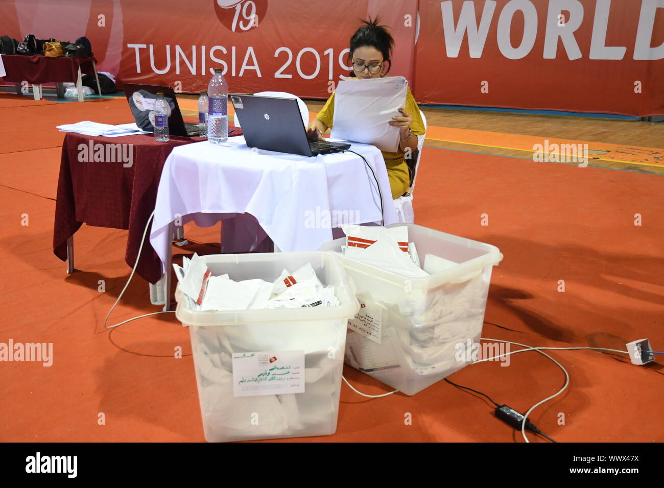Tunis, Tunisia. 16th Sep, 2019. A staff member of the Independent High Authority for Elections (ISIE) counts the votes of the presidential election at the counting center in Tunis, Tunisia, Sept. 16, 2019. The participation rate in the first round of presidential elections in Tunisia reached 45.02 percent, announced Sunday evening by Nabil Bafoun, president of the Independent High Authority for Elections (ISIE). According to the ISIE, preliminary results of the election will be announced on Sept. 17. Credit: Xinhua/Alamy Live News Stock Photo