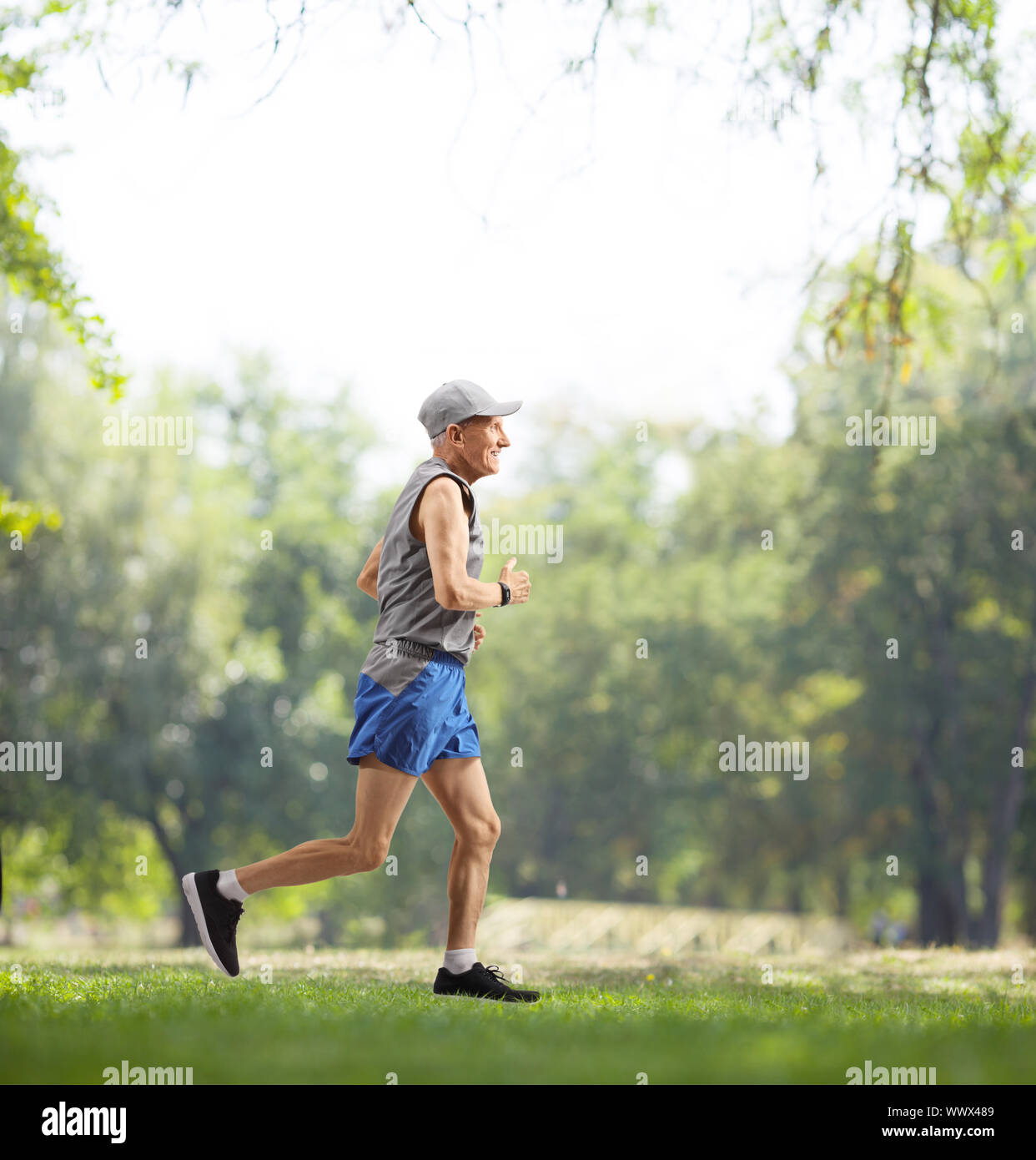 Full length profile shot of an elderly man running outdoors Stock Photo
