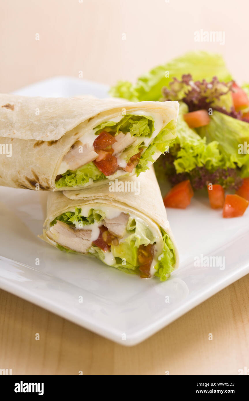 Two avocado wrap with a healthy side salad Stock Photo