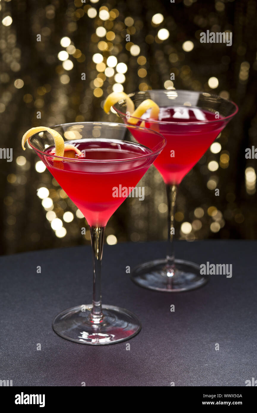 Cosmopolitan cocktail with lemon garnish Stock Photo Alamy
