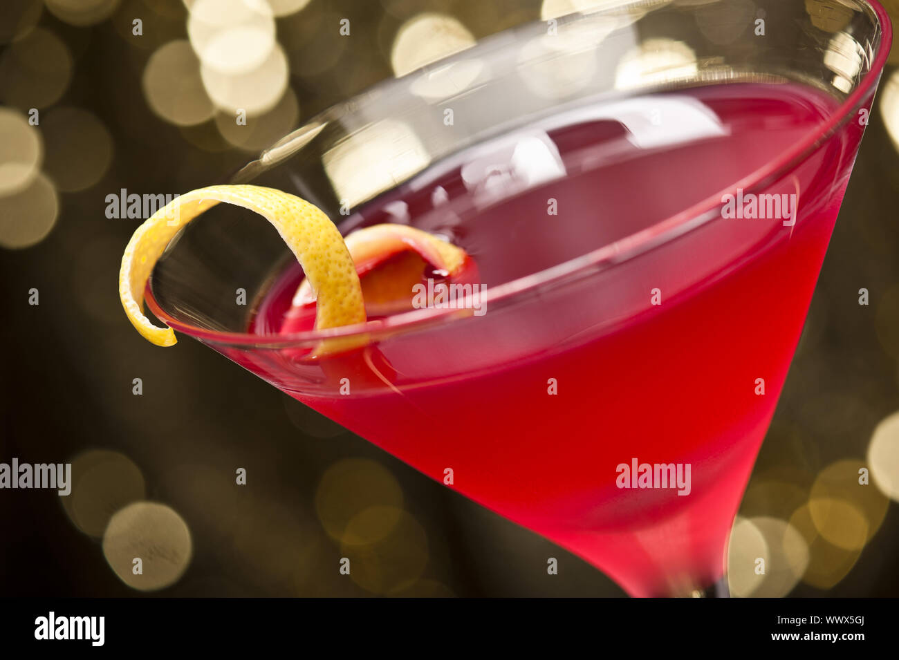 Cosmopolitan cocktail with lemon garnish Stock Photo Alamy