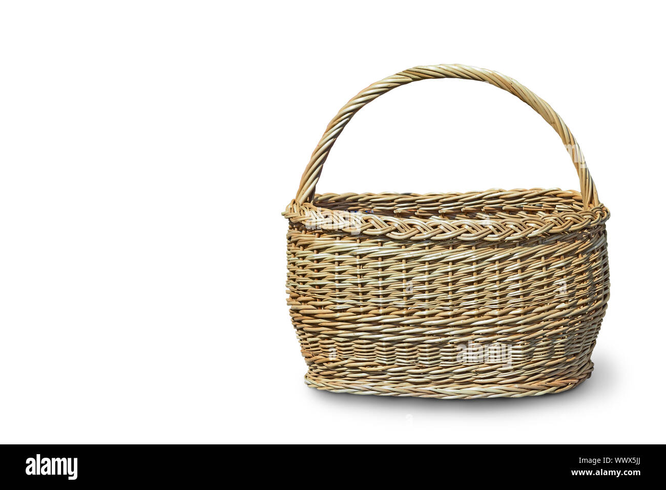 Comfortable wicker basket on a white background. Stock Photo