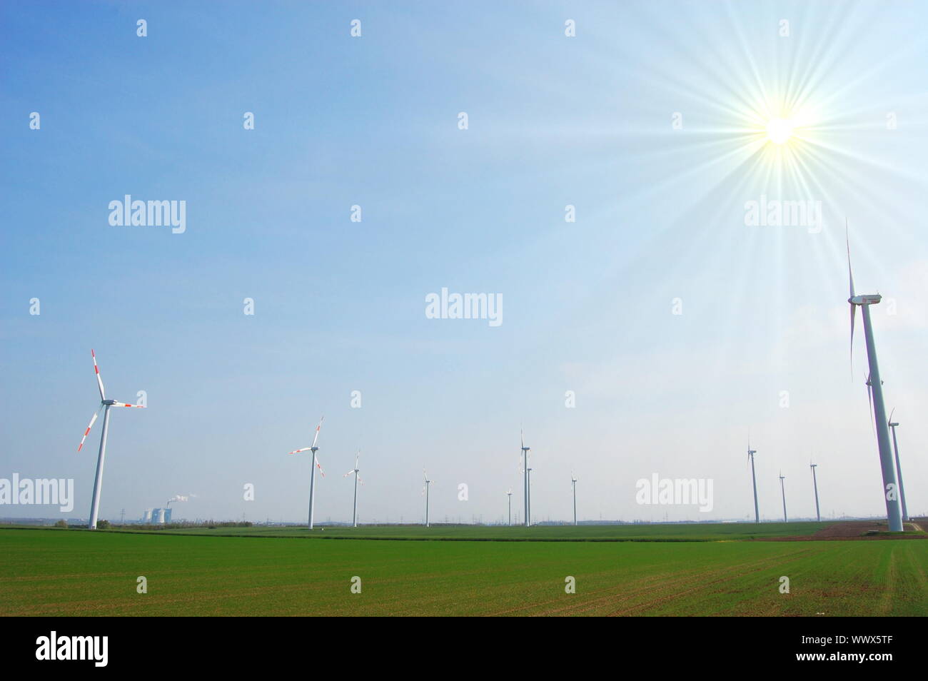 wind turbine under blue sky for alternative energy Stock Photo - Alamy