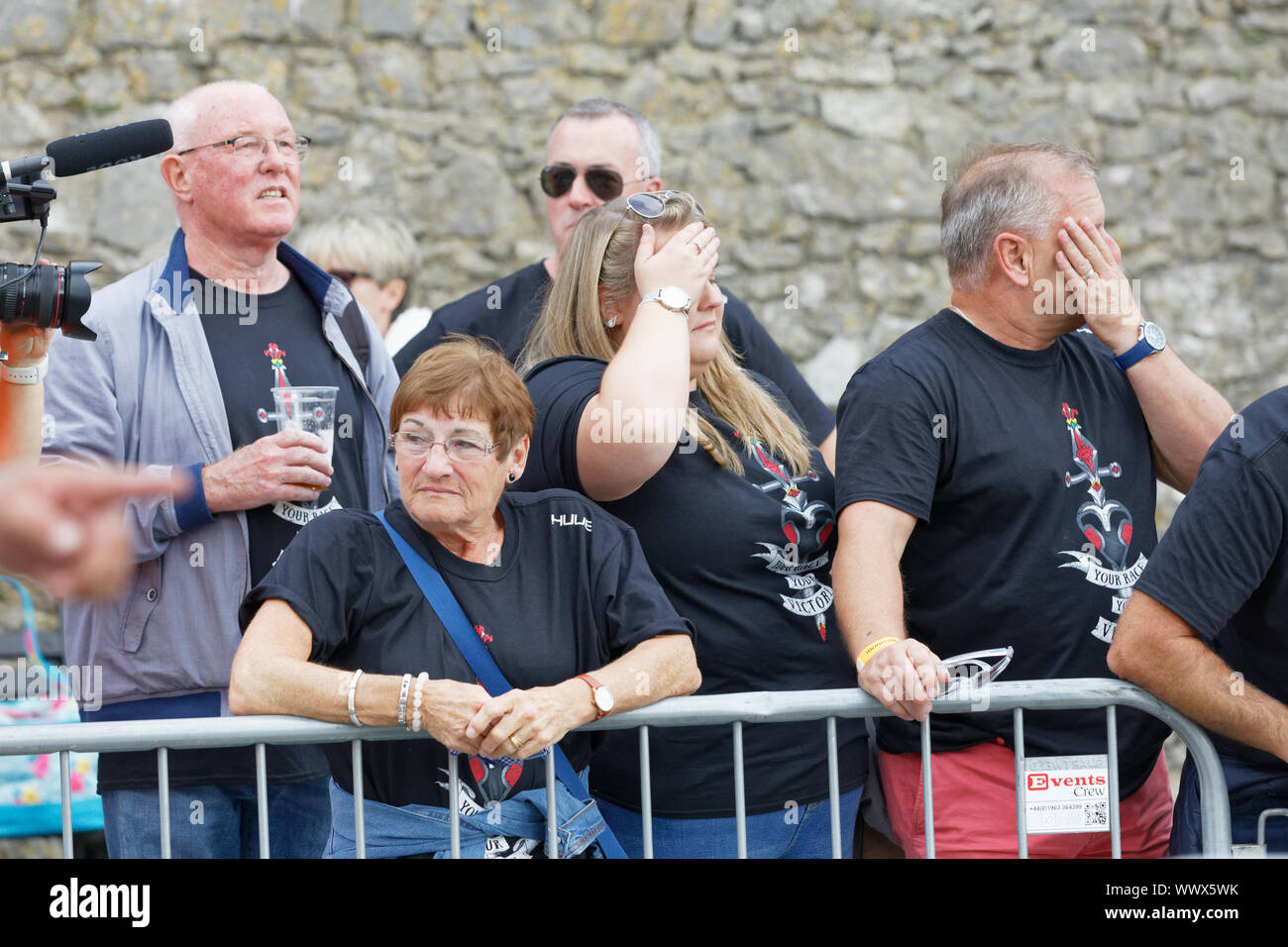 Tenby, UK. 15th Sep, 2019. Pictured: The parents of Gareth Thomas Yvonne (2nd L), Barry (L) and husband Stephen (R). Sunday 15 September 2019 Re: Ironman triathlon event in Tenby, Wales, UK. Credit: ATHENA PICTURE AGENCY LTD/Alamy Live News Stock Photo