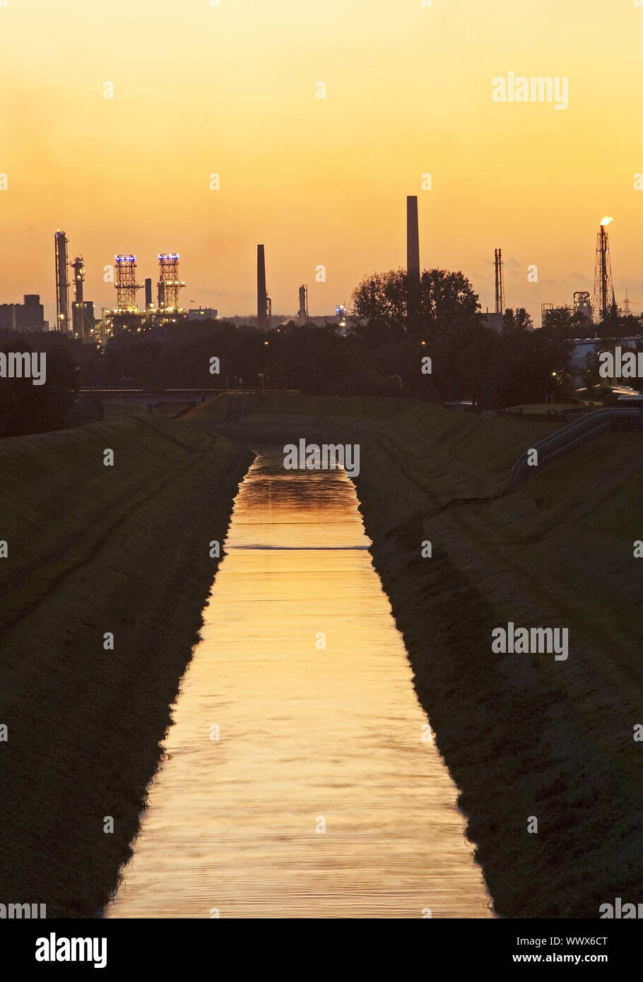 river Emscher with BP oil refinery at sunset, Gelsenkirchen, Ruhr Area, Germany, Europe Stock Photo