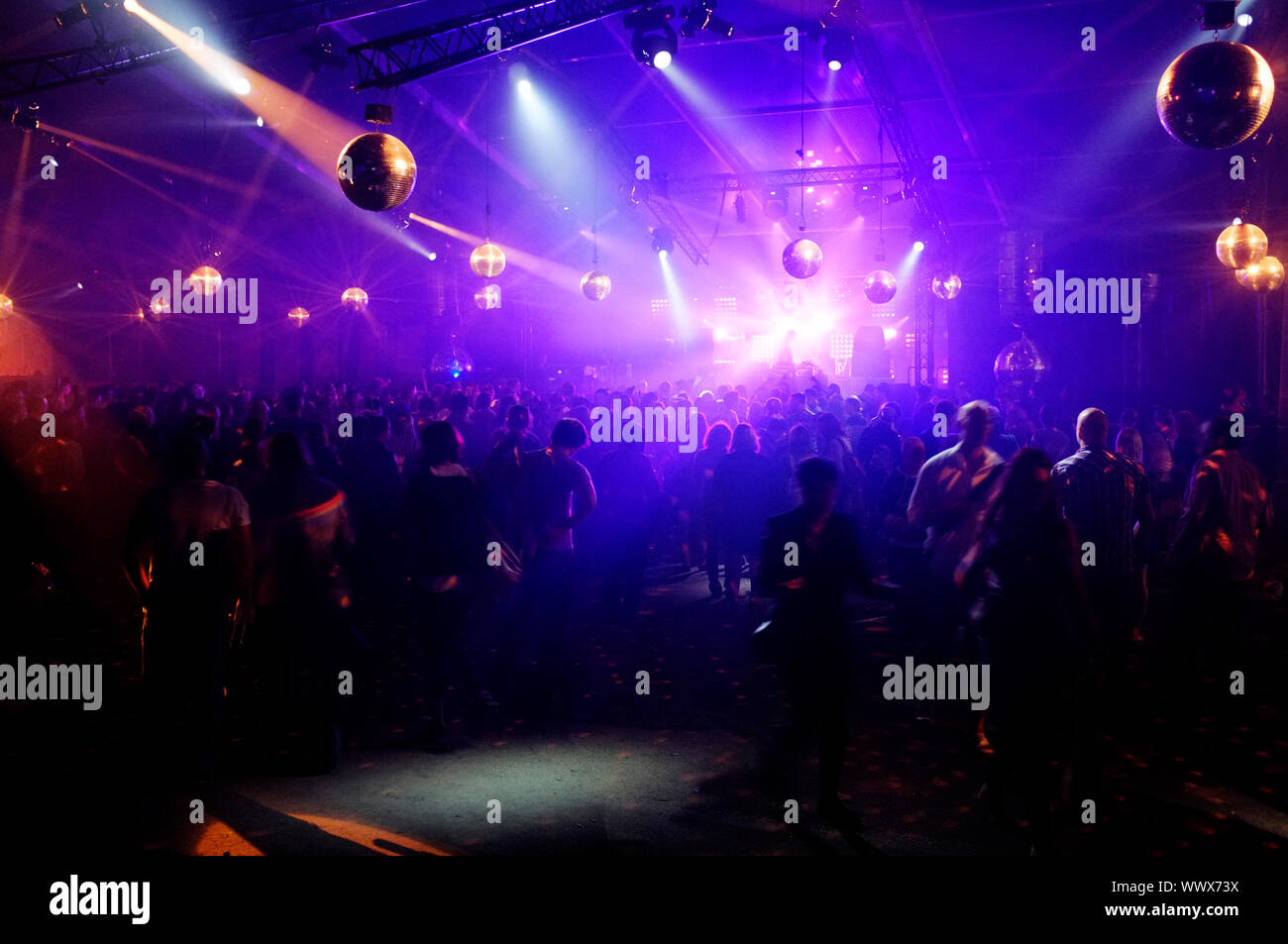 DJ entertaining a crowd in a party tent Stock Photo - Alamy