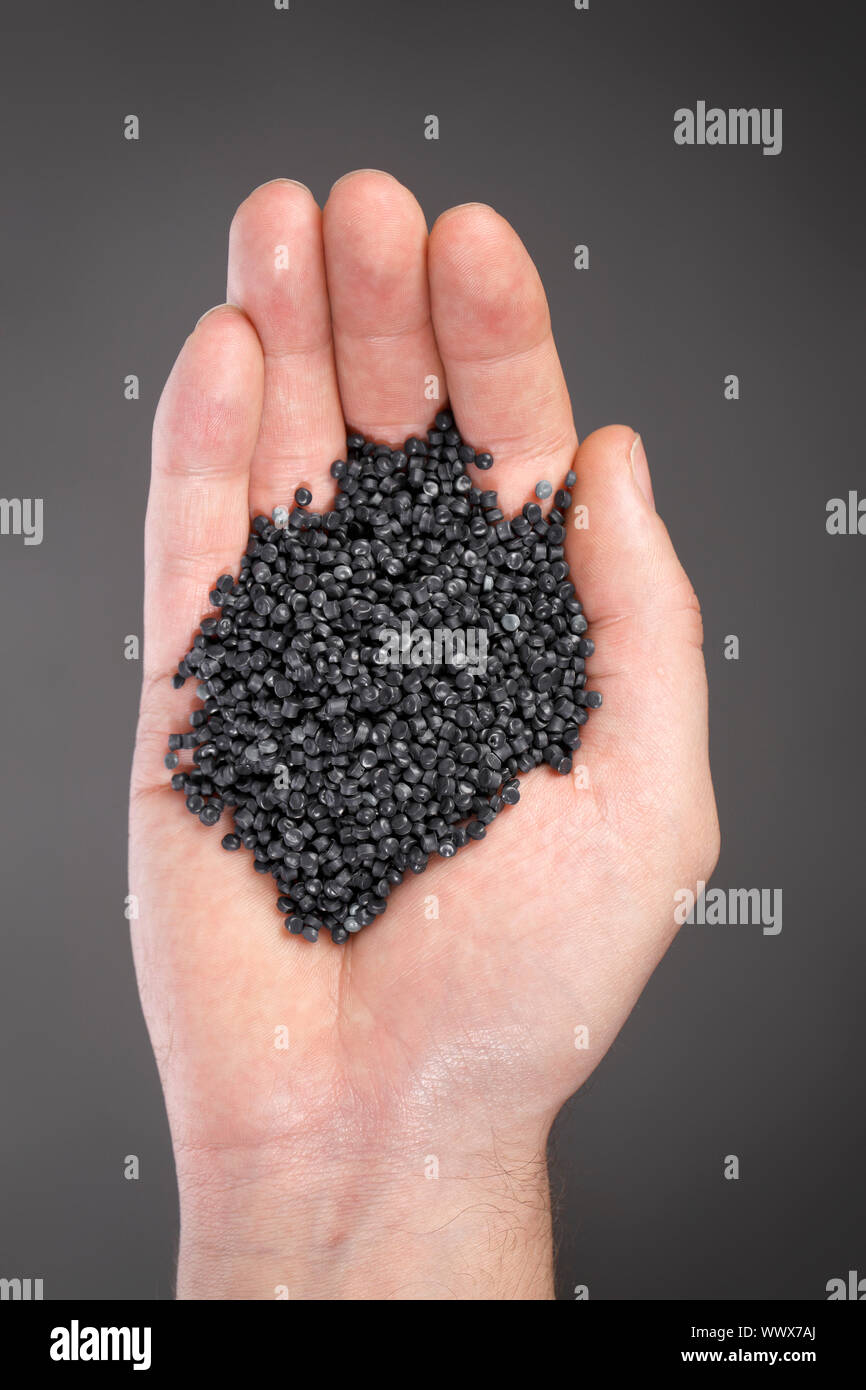 Granular recycled plastic made of car bumpers etc. Stock Photo