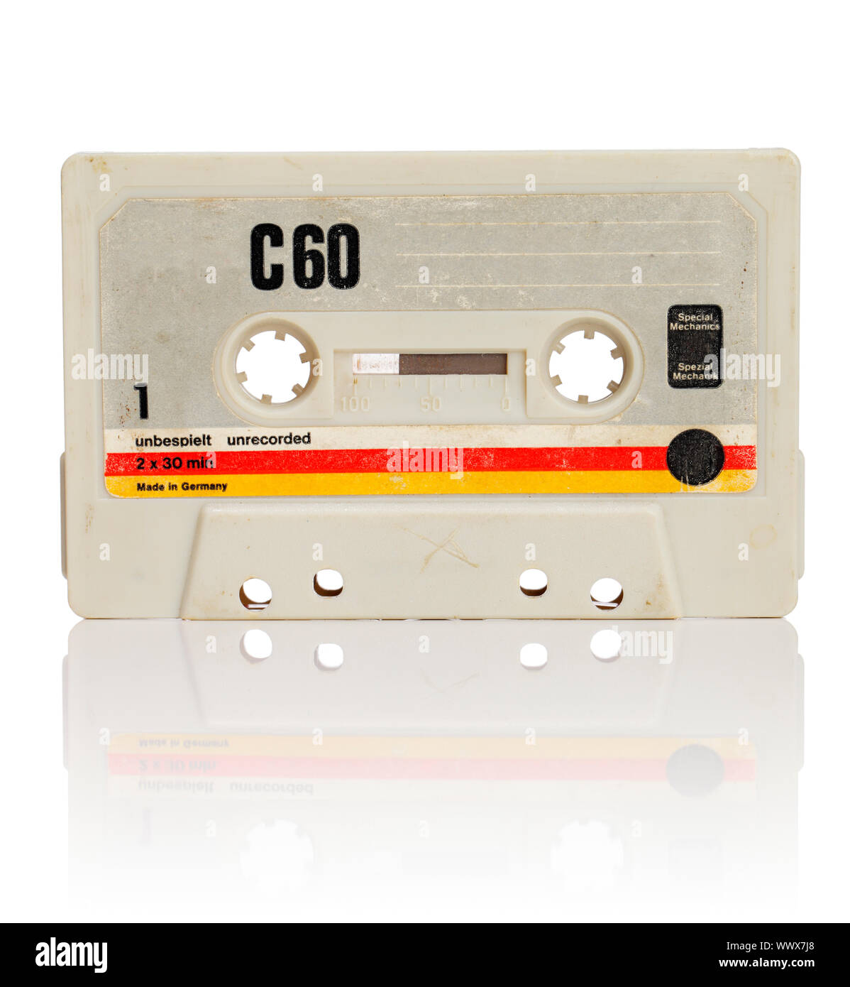 Vintage compact cassette audio tape on white with natural reflection ...