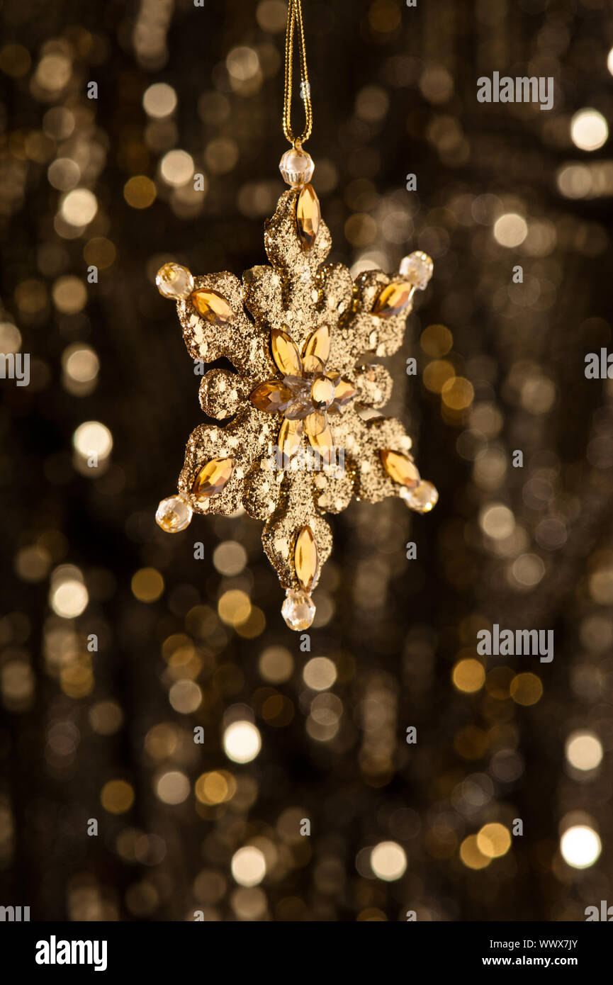 Artificial Snowflake in gold Stock Photo Alamy