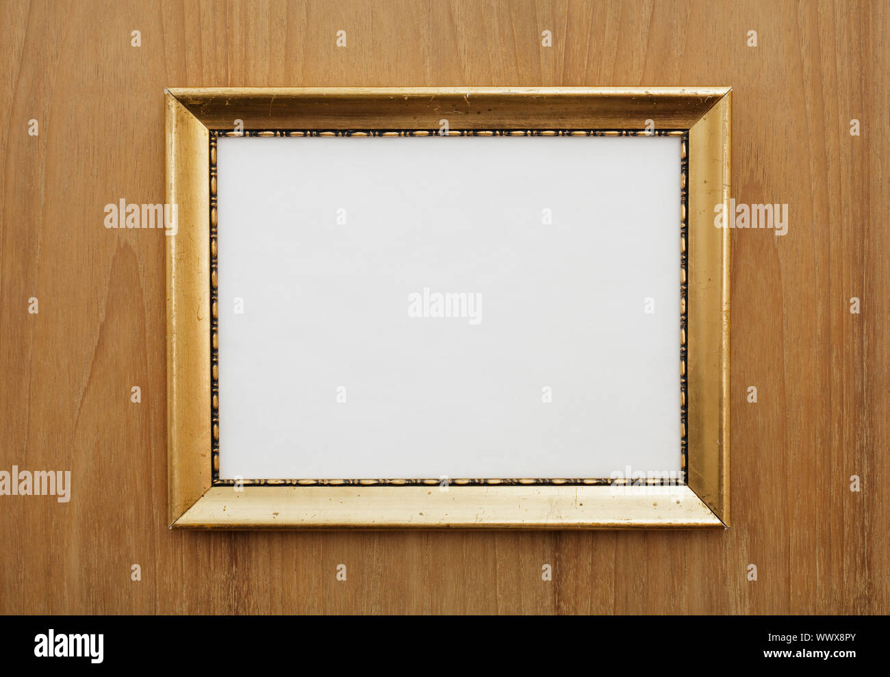 Old photo frame hanging on the wall Stock Photo - Alamy