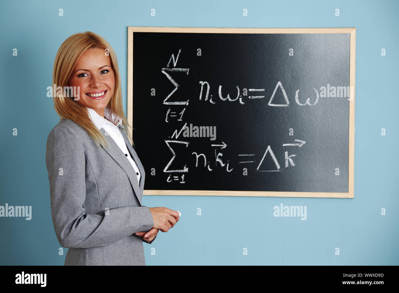 teacher draw condition of phase synchronism Stock Photo