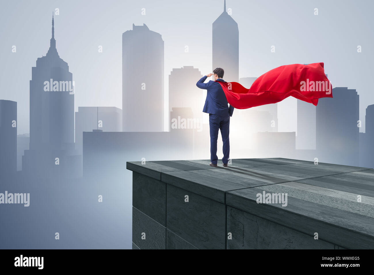 Super hero businessman on top of building ready for challenge Stock ...