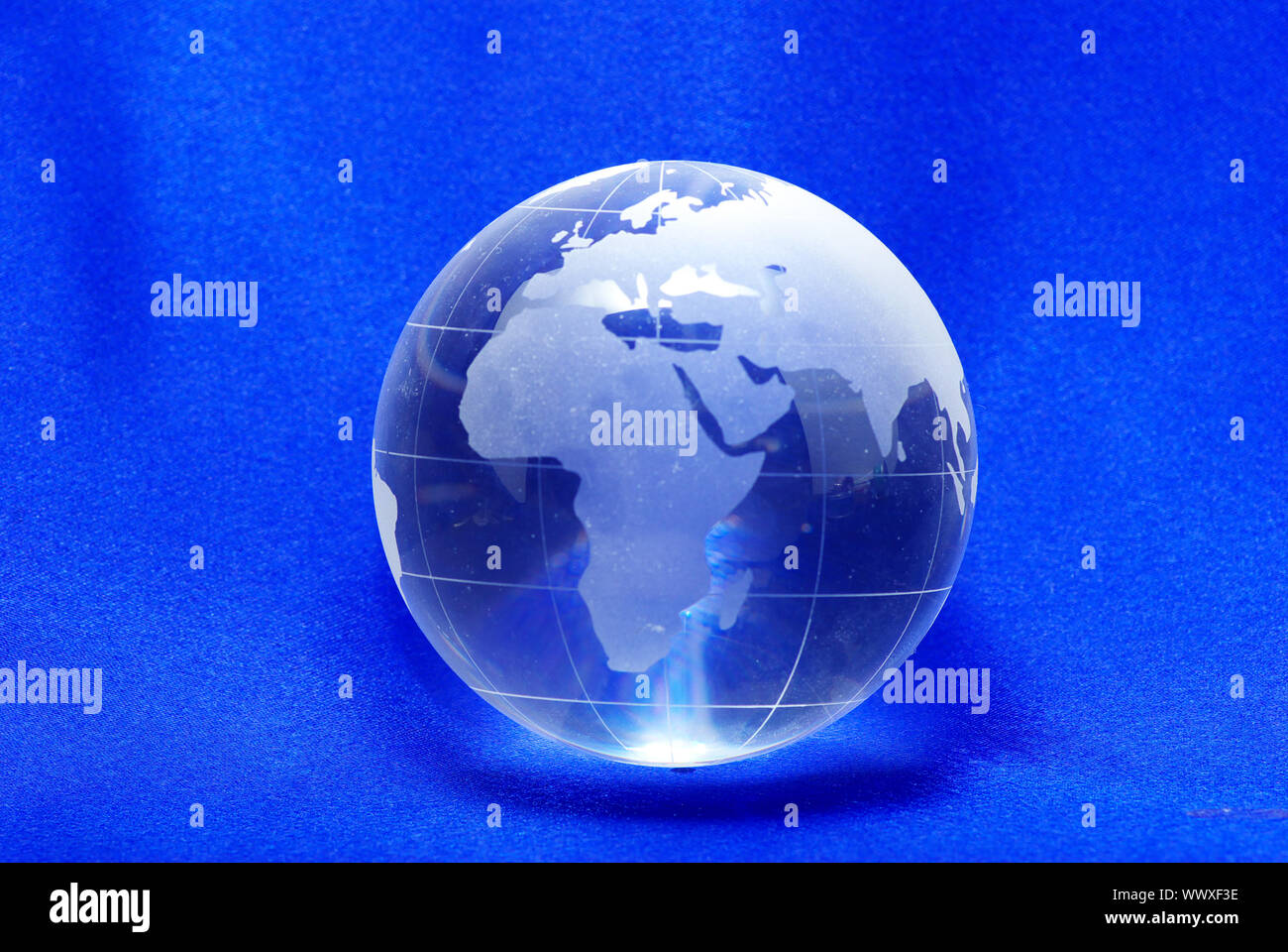 Perfect crystal ball globe isolated on blue Stock Photo Alamy