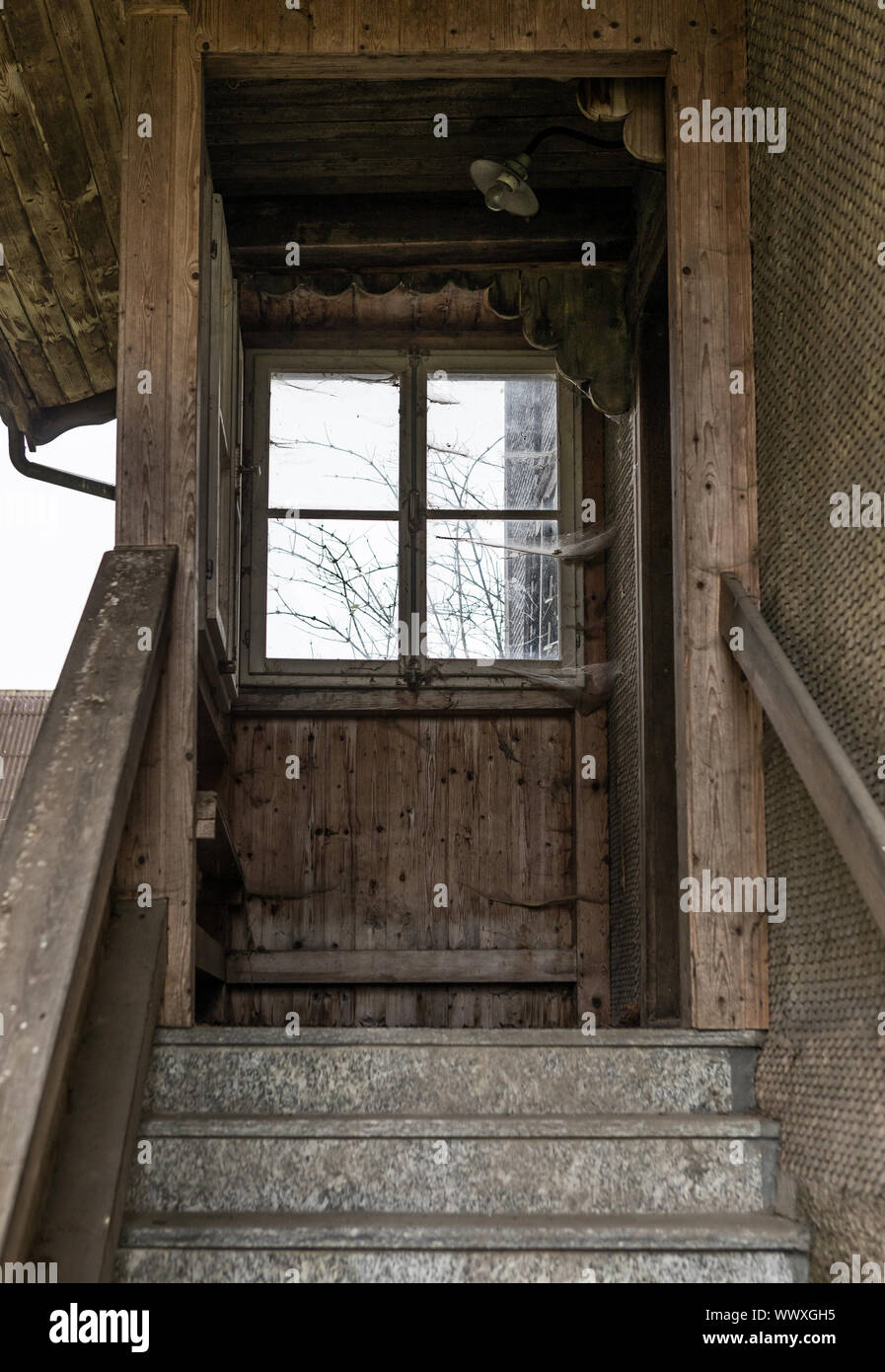Stairs with entrance to abandoned residential and farmhouse - Lost Place Stock Photo