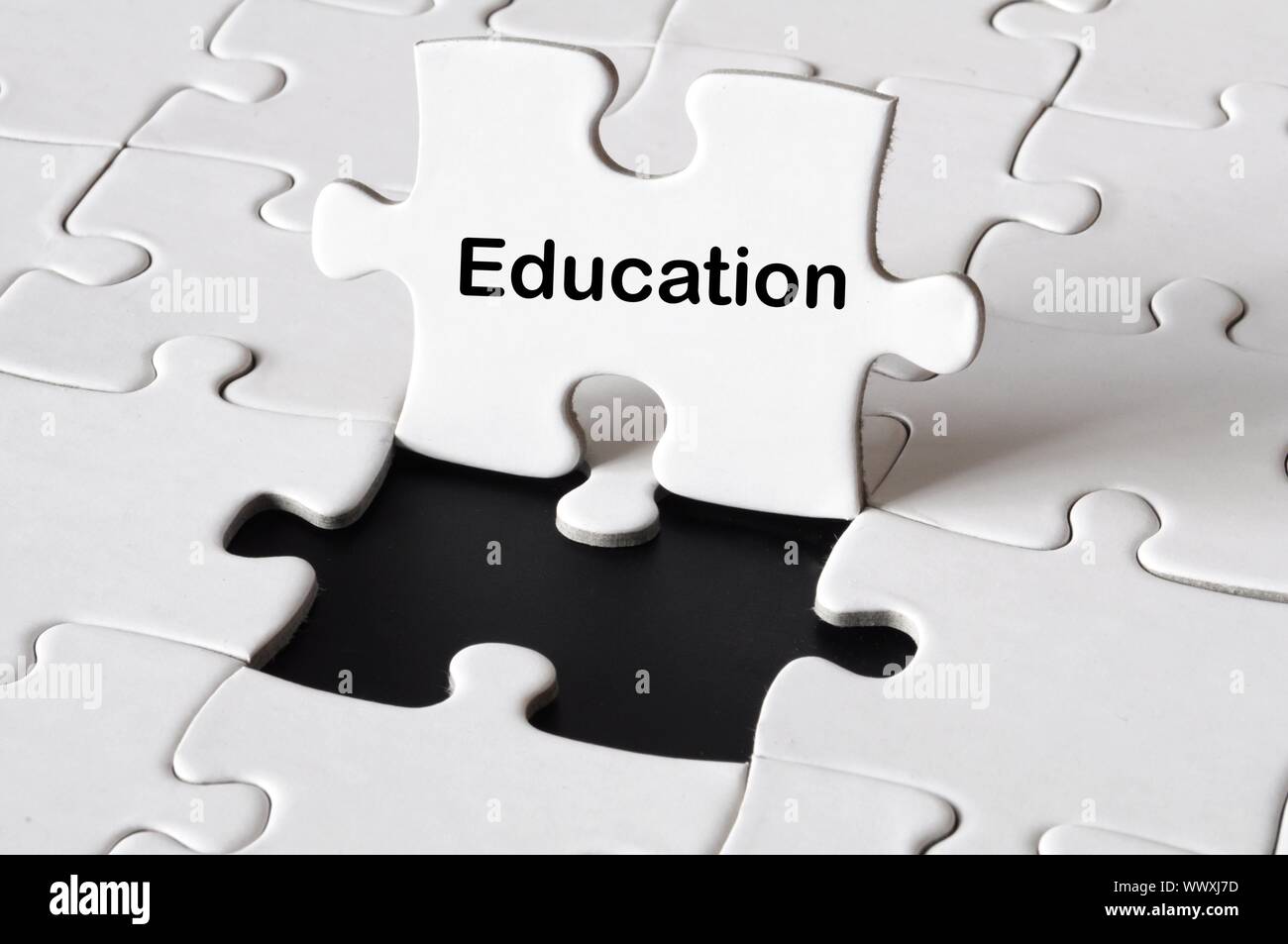 education or school concept with white puzzle Stock Photo - Alamy