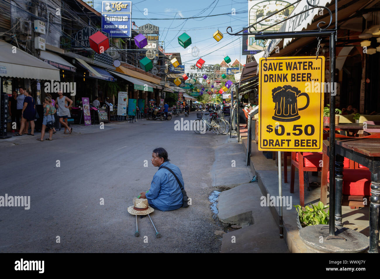 Disable man begging for money in pub street in Siem Reap Cambodia Stock Photo