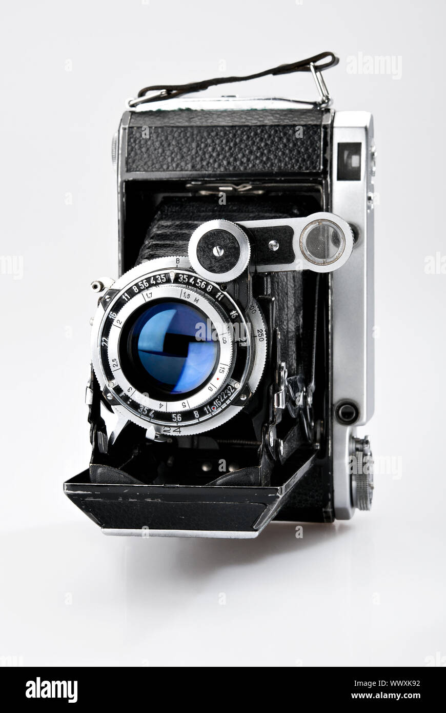 Old vintage photo camera isolated on white background Stock Photo - Alamy