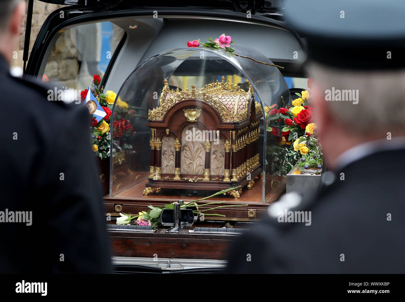 Prison officers carry The relics of Saint Therese of Lisieux through ...