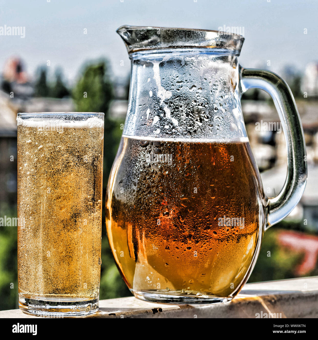 Crafting a beer in a jug and a glass. Summer time Stock Photo Alamy