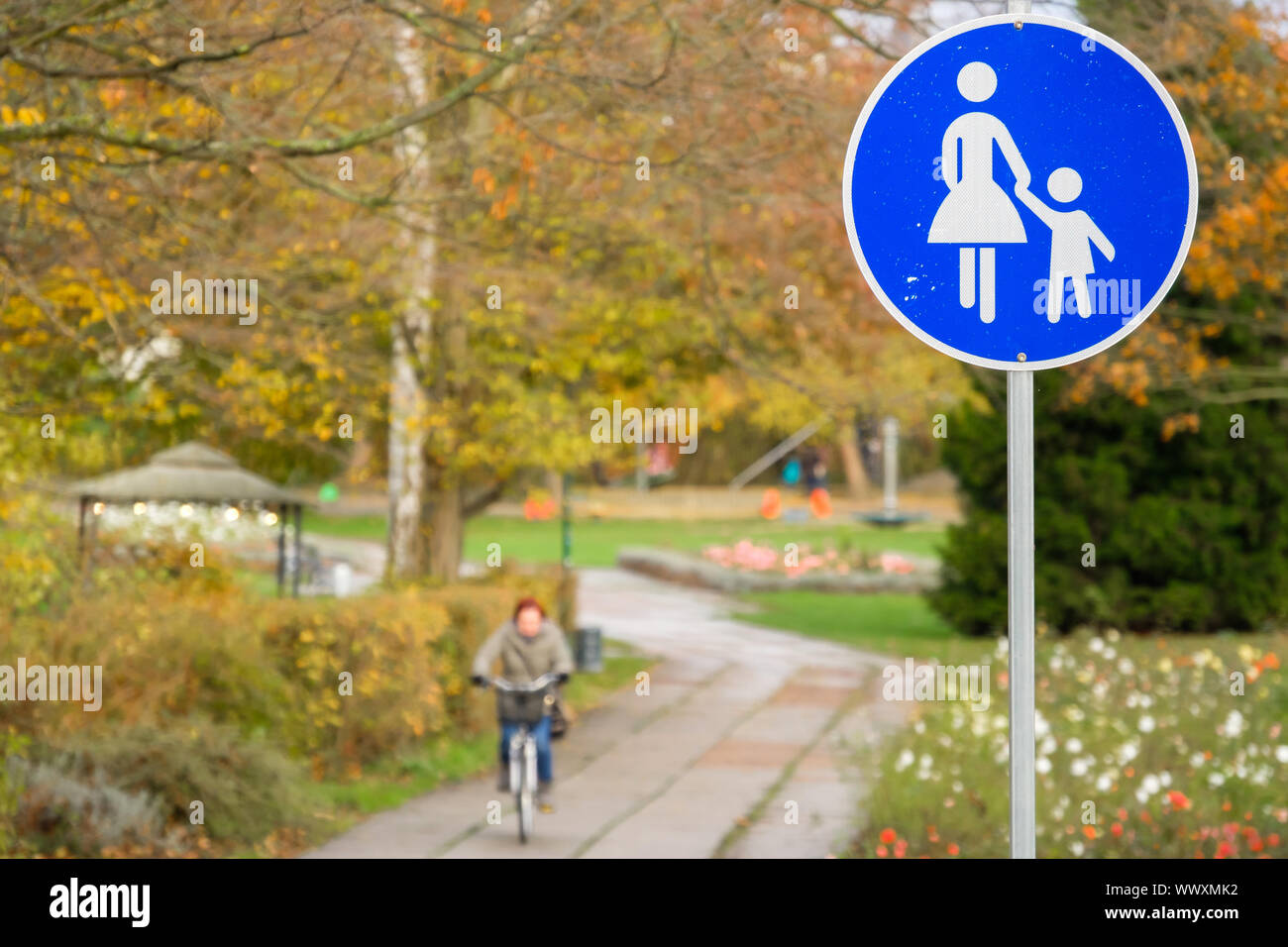 Sign pedestrian zone with cyclist Stock Photo