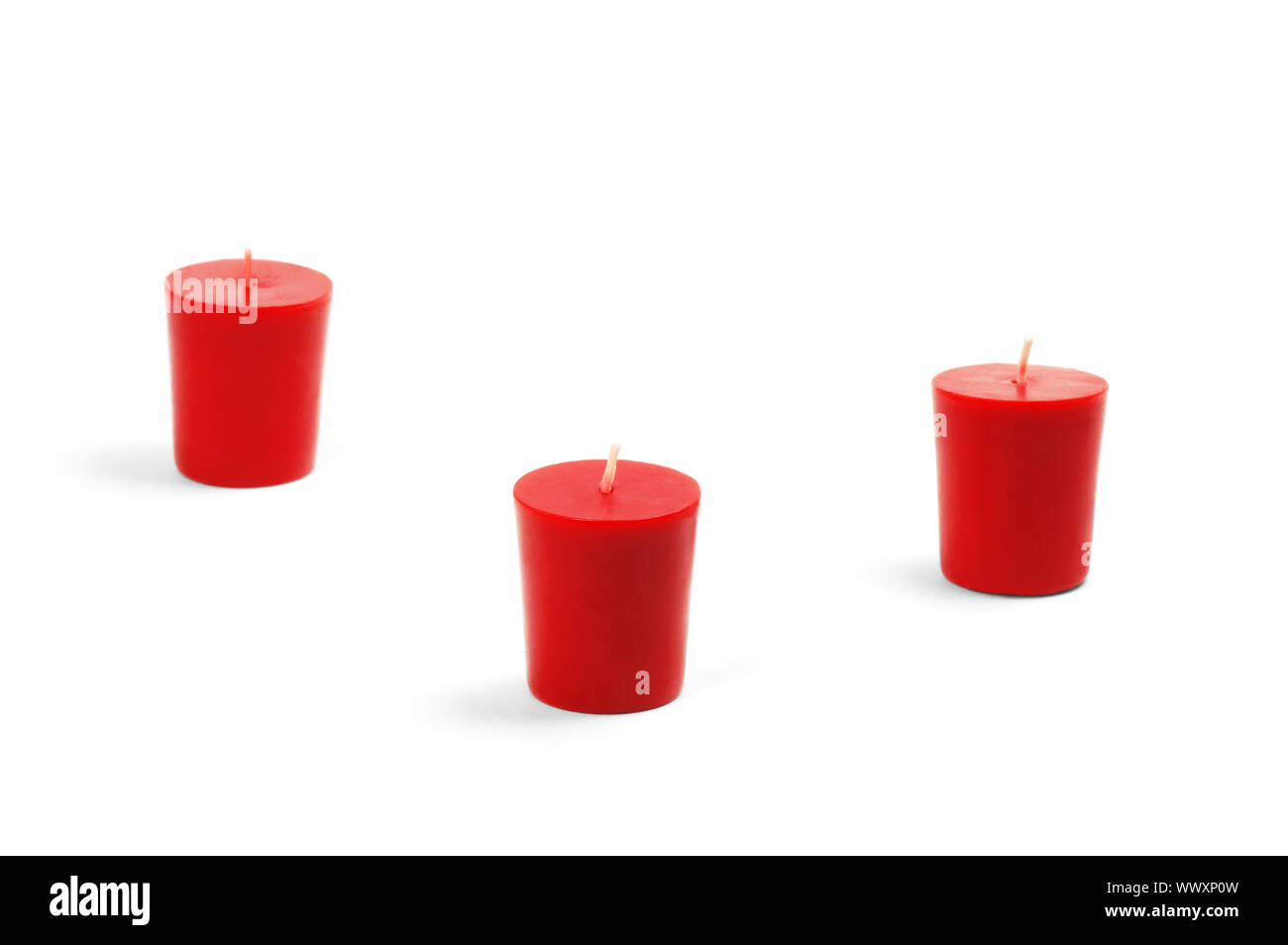 three red candles isolated on white background Stock Photo Alamy