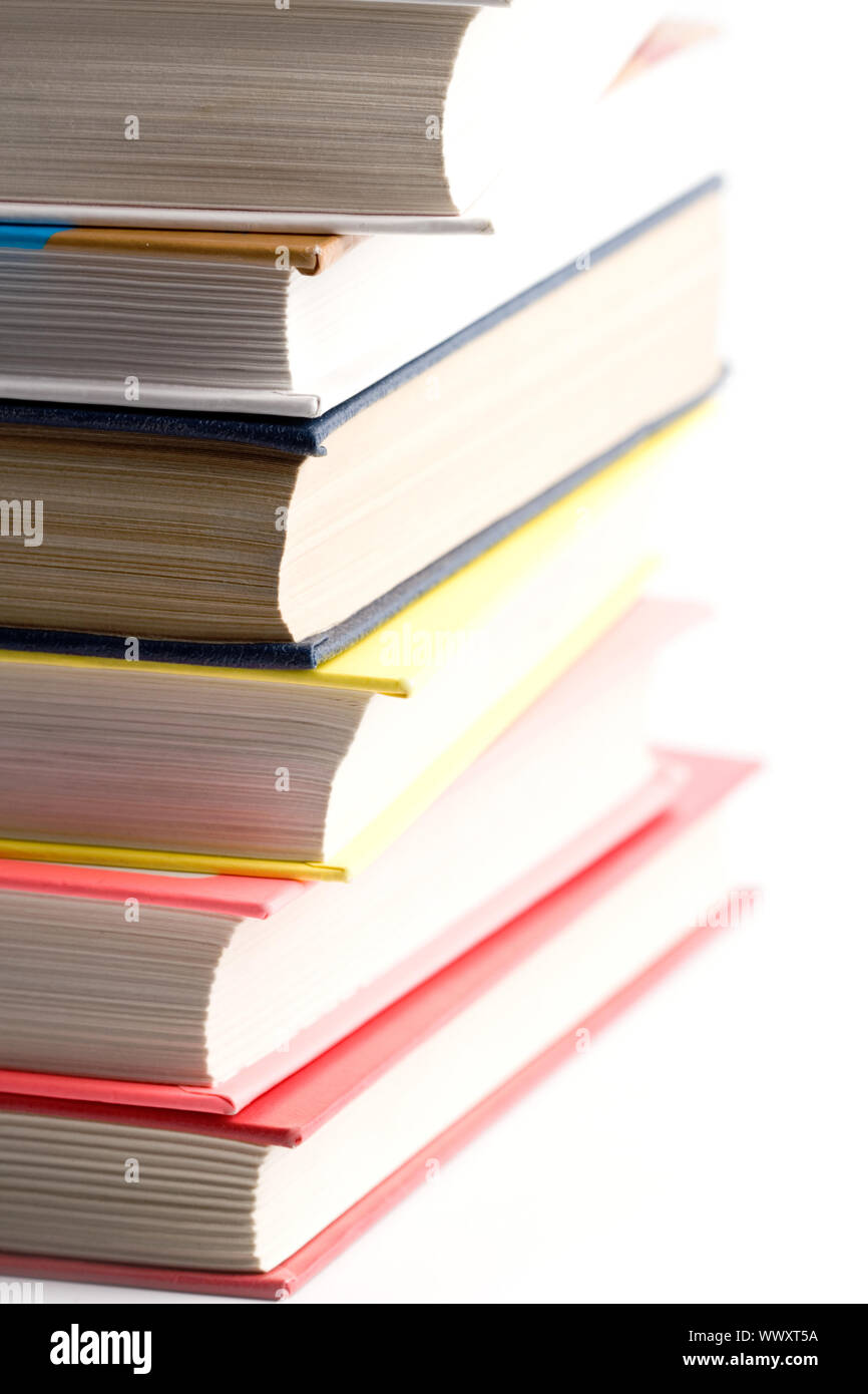 stack of books closeup on white background Stock Photo - Alamy