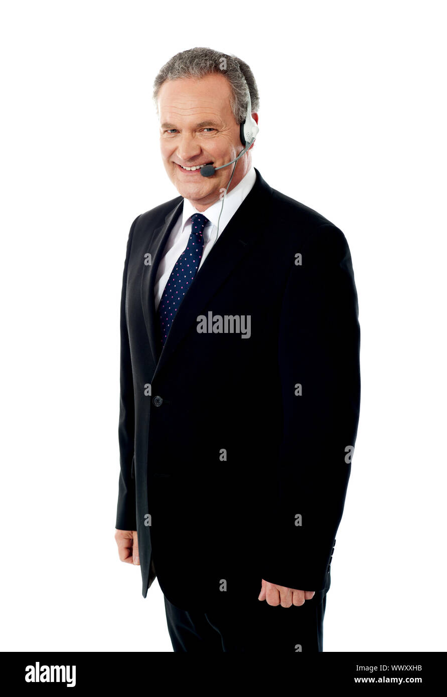 Call centre executive posing with headset in front of camera Stock Photo -  Alamy