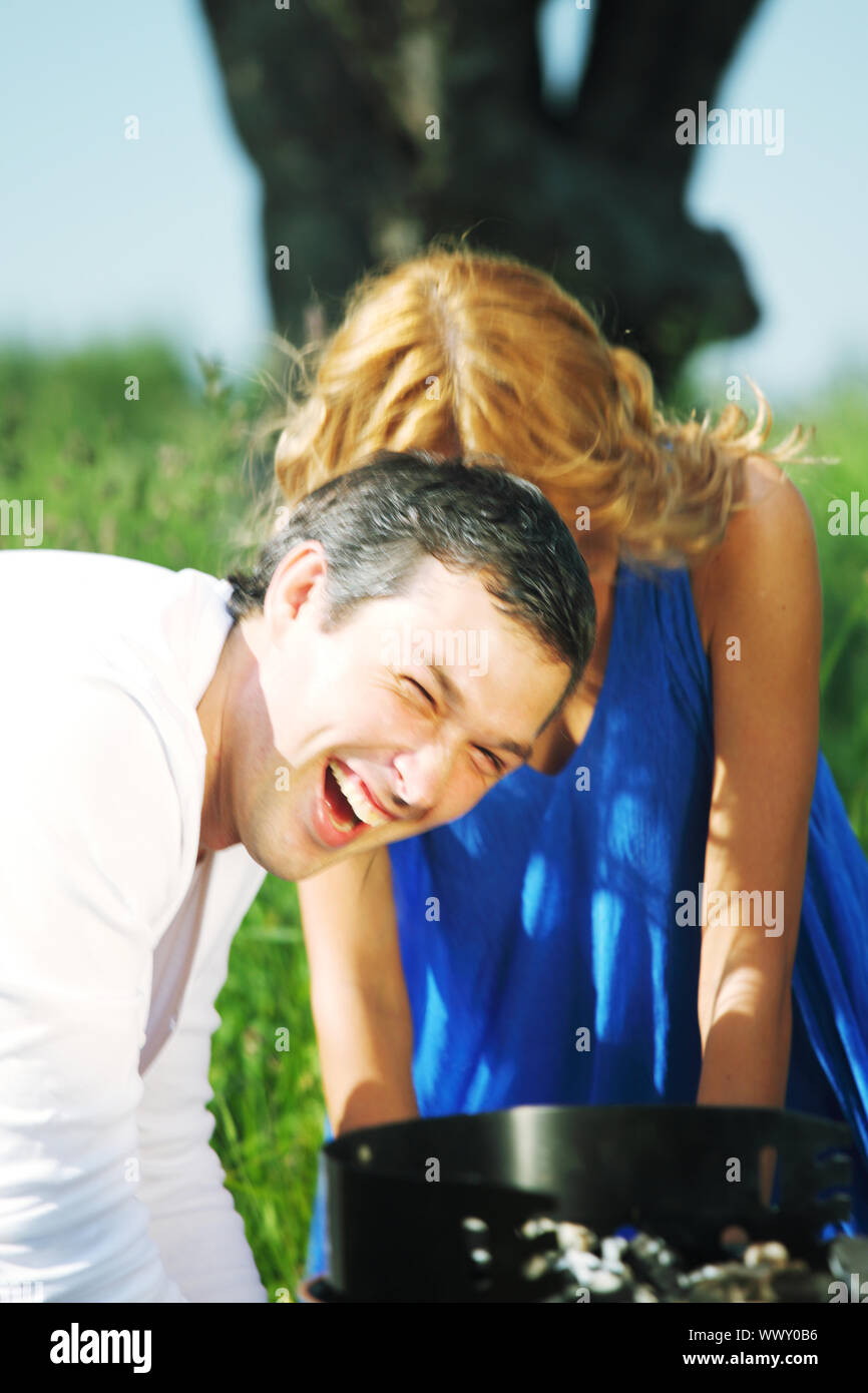 man and woman on picnic in green grass Stock Photo - Alamy