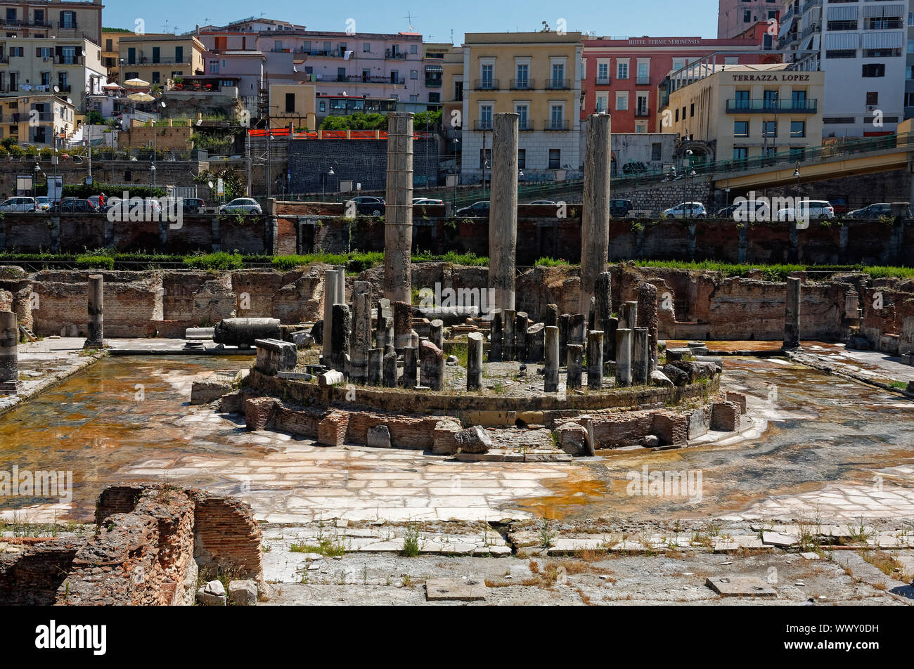 Macellum di Pozzuoli; Tempi di Serepide; market; columns measure height of sea level; 1st century; old ruins; buildings, city scene, vehicles parked, Stock Photo