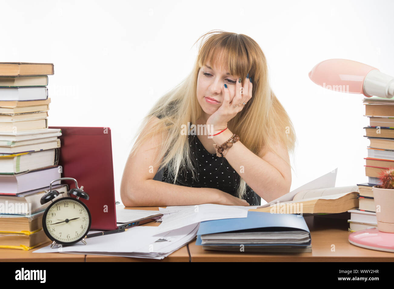 Upset Applicant sad looking at a laptop which saw not enrolled in school Stock Photo