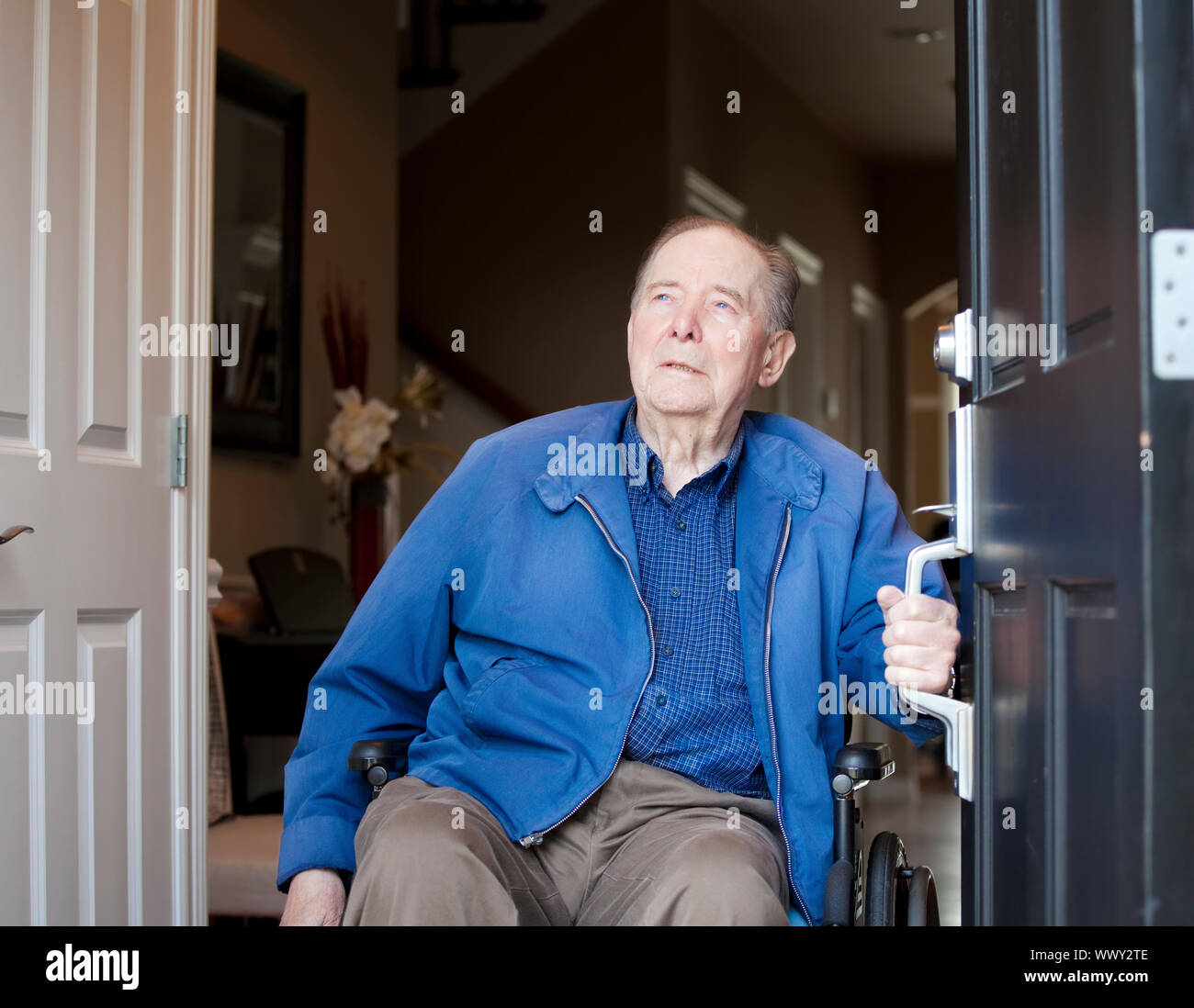 Elderly 90 Yr Old Man In Wheelchair At His Front Door