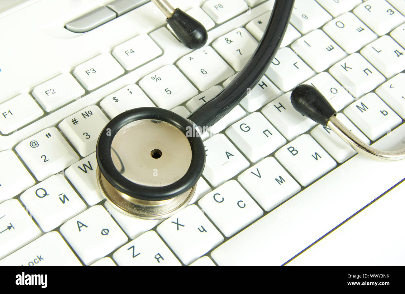 white computer keyboard with a stethoscope Stock Photo - Alamy