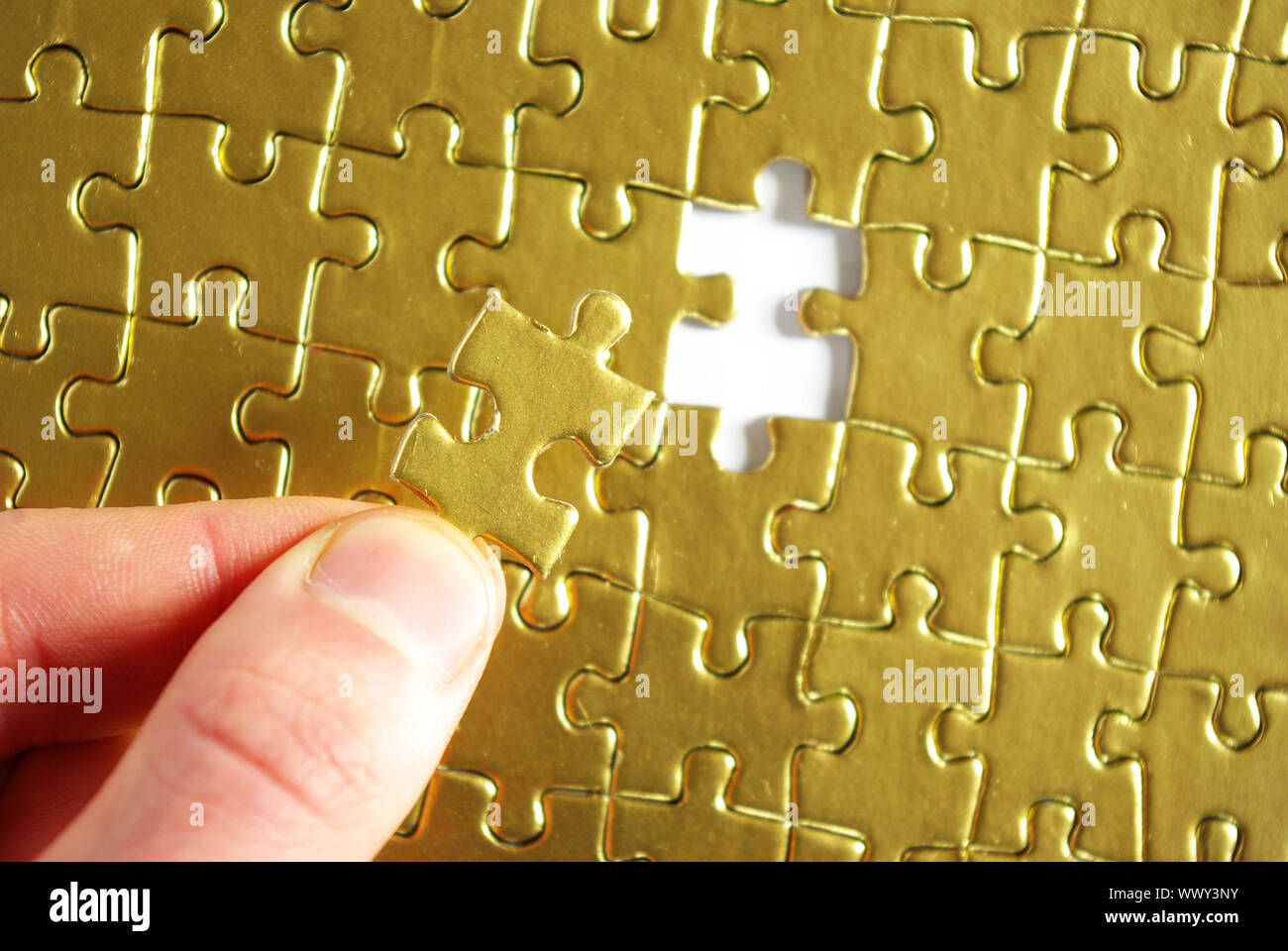 hands holding a puzzle piece . business concepts Stock Photo - Alamy