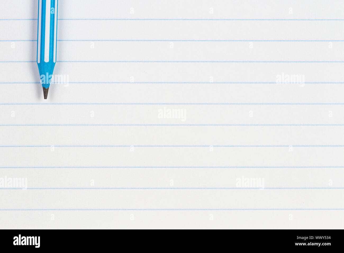 Blue Striped Pencil On Notebook Lined Paper Background With Copy Space Back To School Education Learning Concept Stock Photo Alamy
