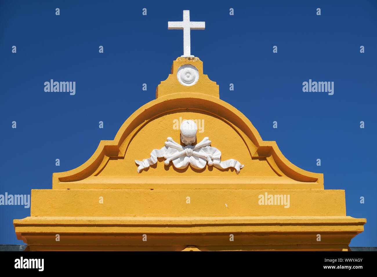 A pediment of cementery gate decorated by  the Tonenkopf. Mertola. Portugal. Stock Photo