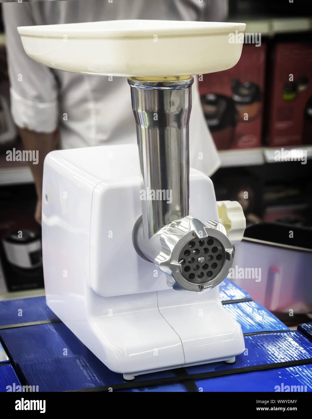 Modern electric meat grinder appliances store Stock Photo - Alamy