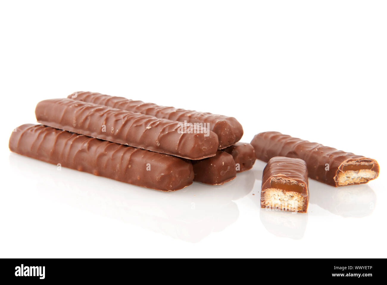 chocolate candy bar with caramel inside isolated over white Stock Photo