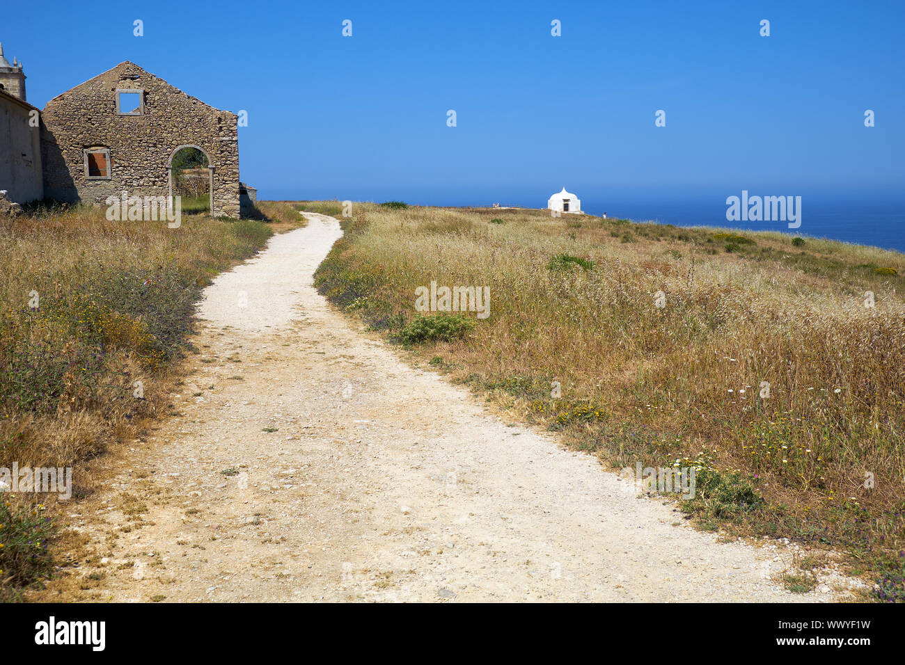 Path near Our Lady of the Cape or Nossa Senhora do Cabo Church near cape Espichel, Portugal Stock Photo
