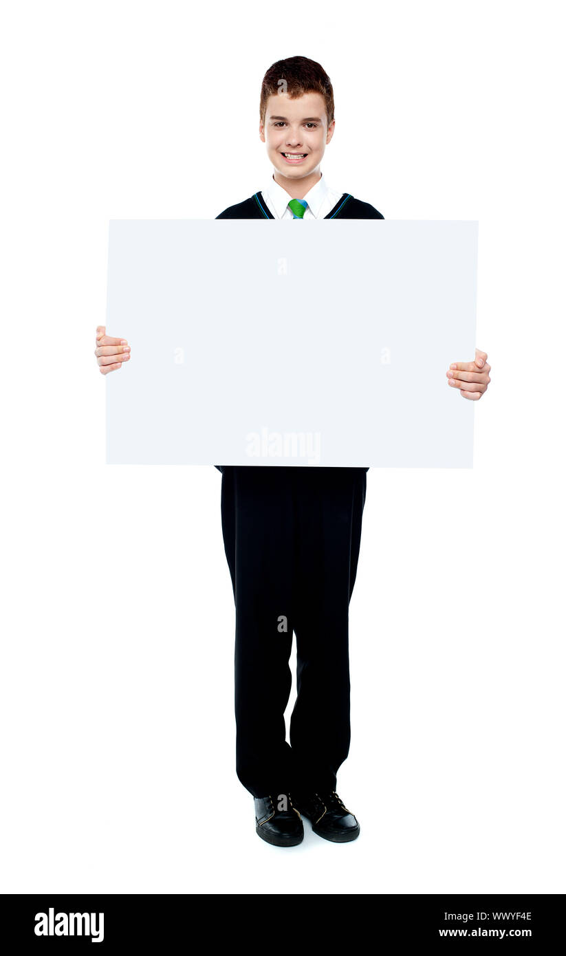 Young boy showing blank billboard against white background Stock Photo ...