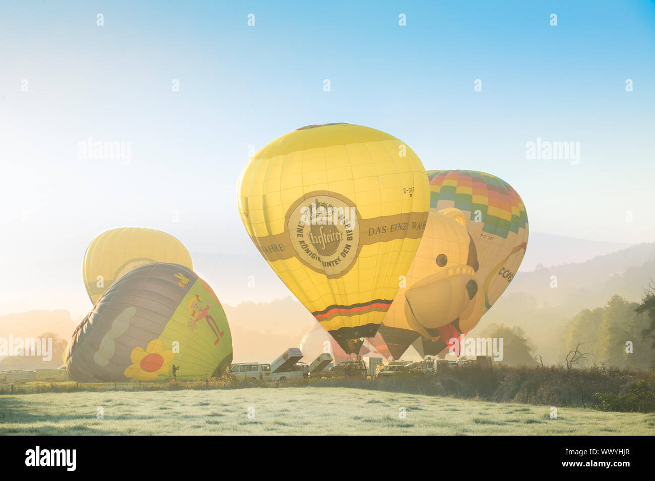 Arnsberg, North Rhine Wesstphalia/Germany - August 31st 2019: Start of the hot air balloons in Oeventrop/Arnsberg in the morning mist. Warsteiner Inte Stock Photo