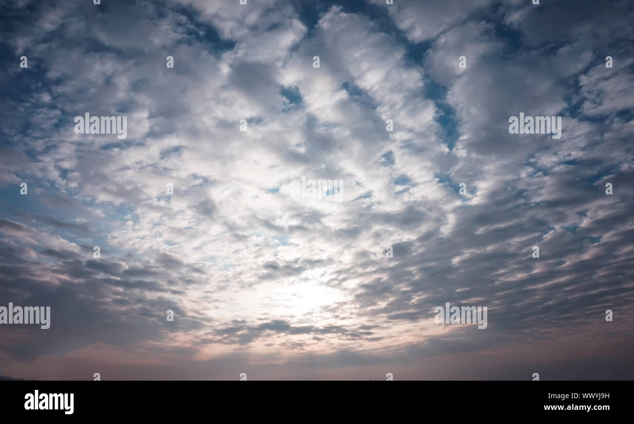 Blue sky and white fluffy clouds Stock Photo - Alamy