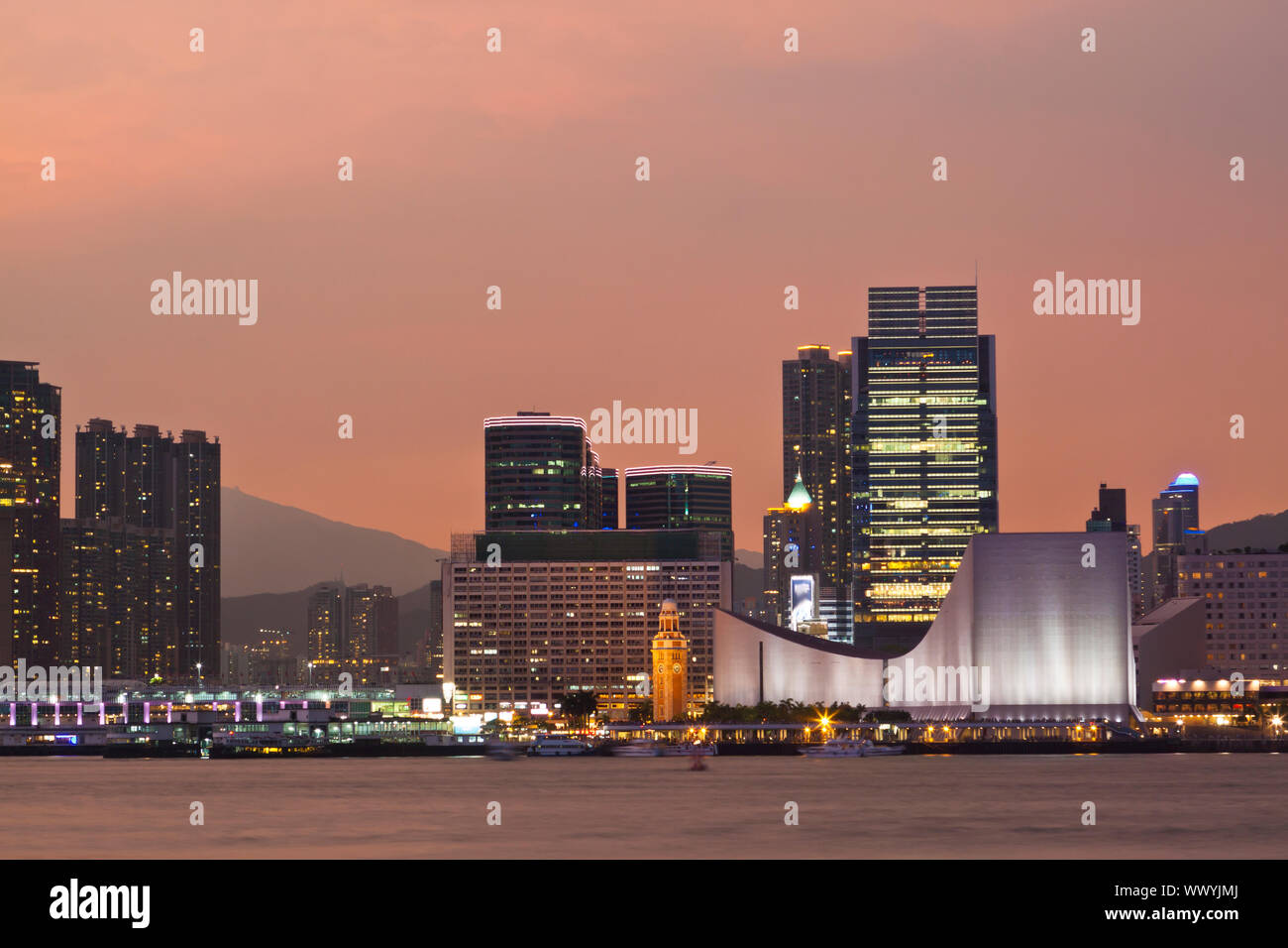 Hong Kong sunset at clock tower Stock Photo - Alamy