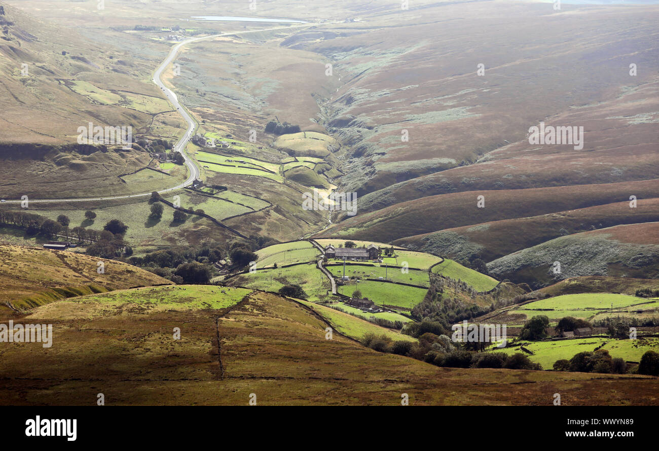 aerial view of a little valley with a remote farmhouse in the Pennine Hills, UK Stock Photo