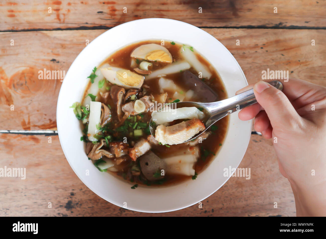 eating noodle, Chinese noodle or pork and egg noodle Stock Photo