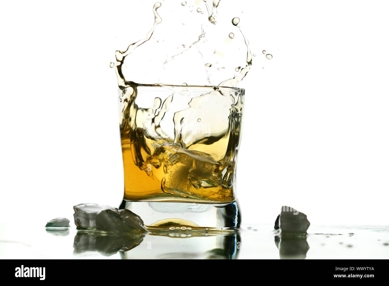 whisky splash alcohol drops isolated on white Stock Photo