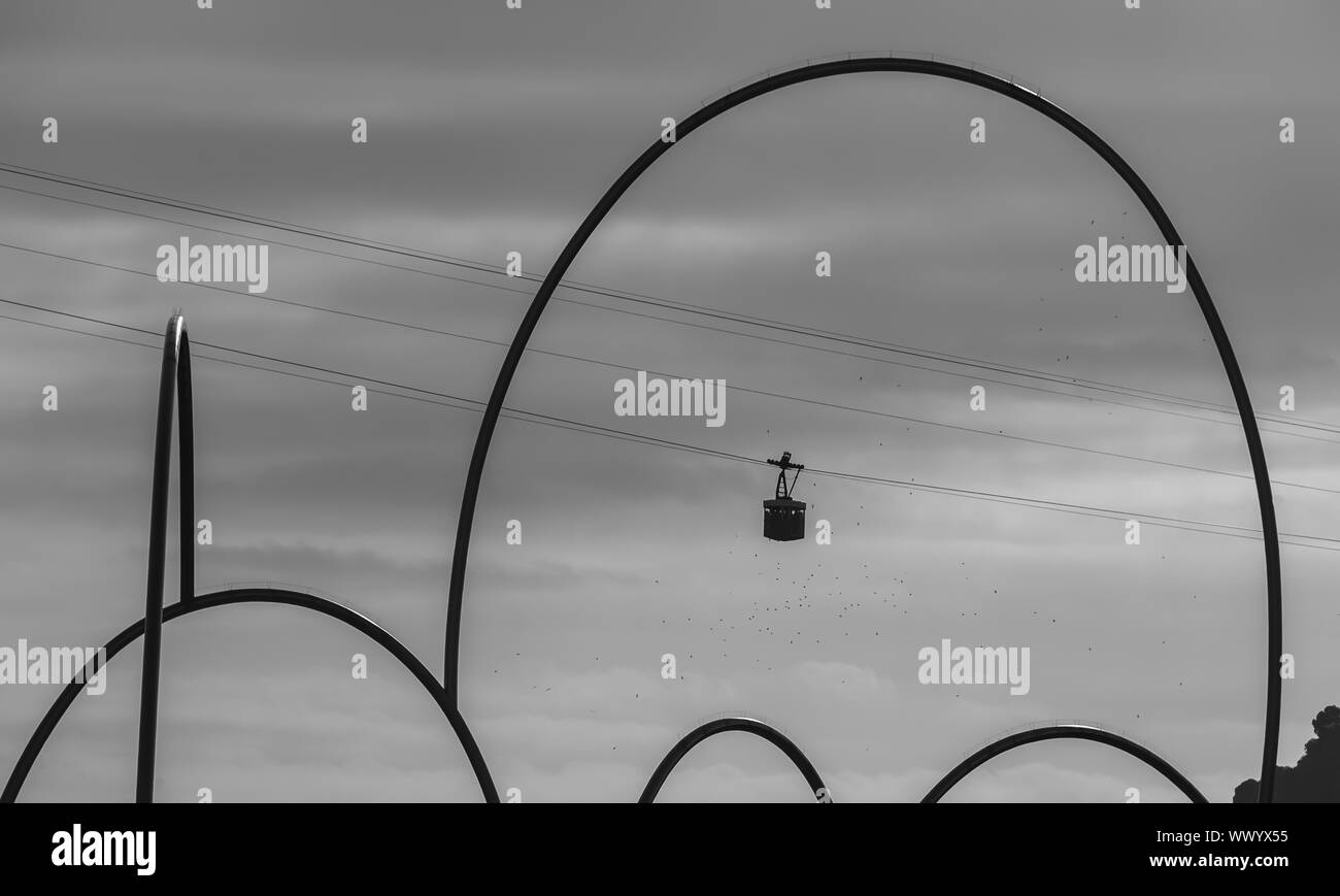 A black and white picture of the Port Cable Car passing through a ...