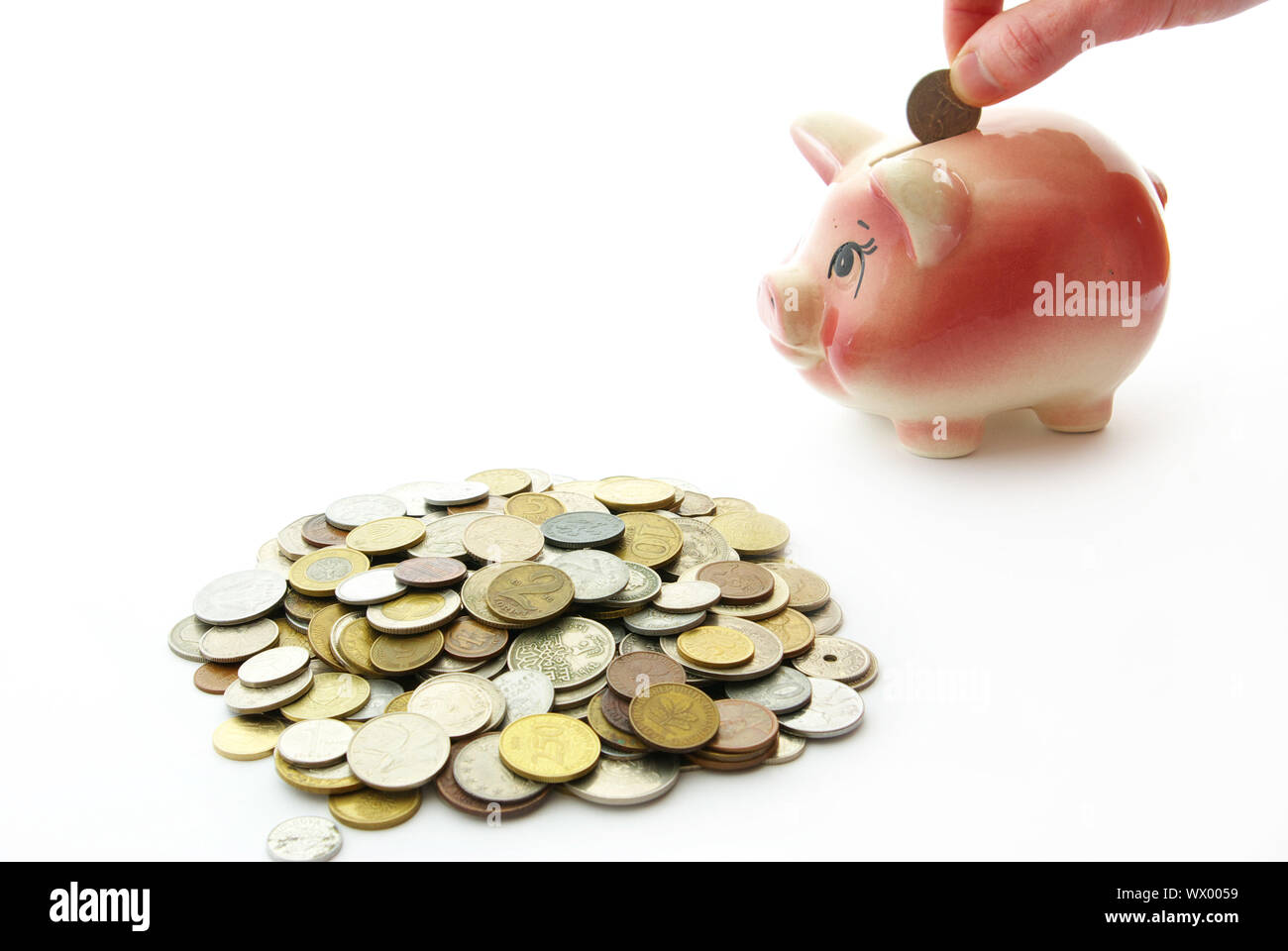 Pink piggy bank isolated on white background with coins Stock Photo - Alamy