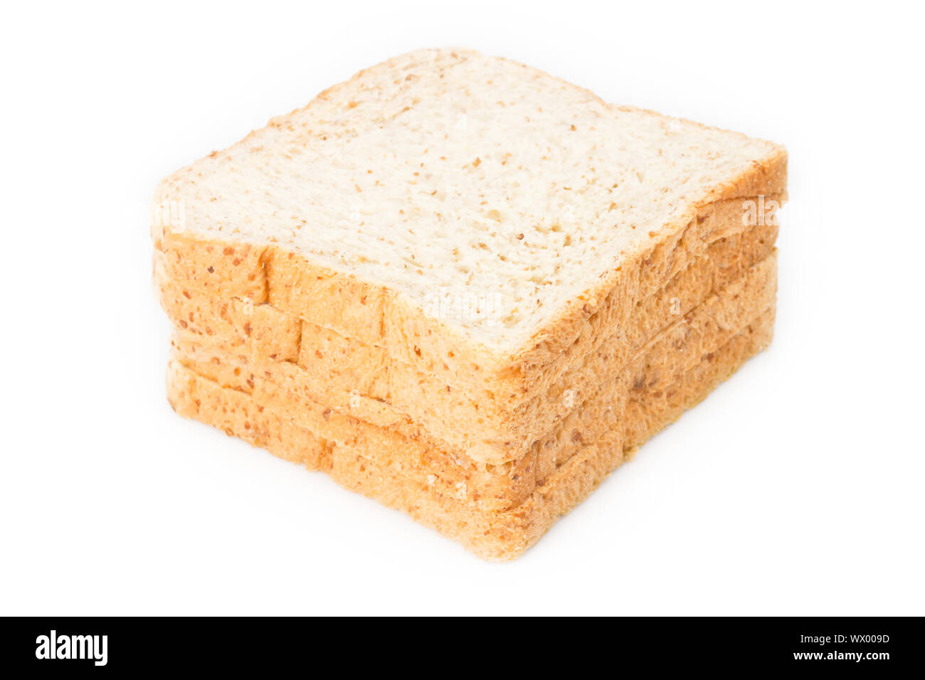 Stack of whole wheat bread on white background Stock Photo - Alamy